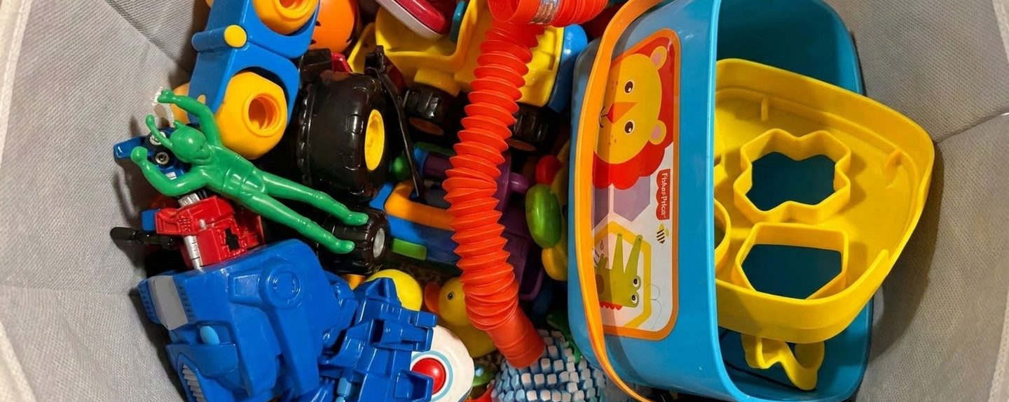 A bin overflowing with plastic toys, a stand-in for a product cluttered with features no one uses.