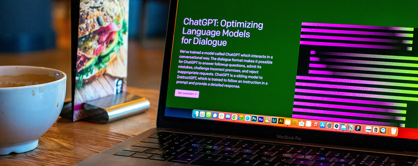 Laptop at a restaurant with an internet browser showing ChatGPT splash screen. Photo by Emiliano Vittoriosi on Unsplash